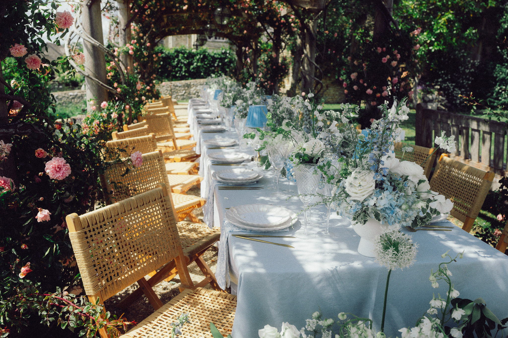 Luxury garden wedding table at Euridge Manor surrounded by florals and sunlight — captured in a cinematic, documentary style by The Swiechs.