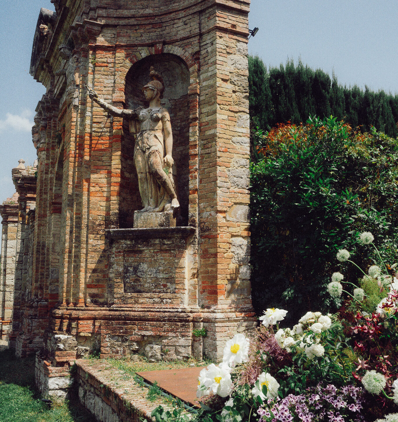 Villa di Geggiano wedding in Tuscany with historic stone facade and romantic garden setting